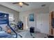 Bedroom features a bunk bed, desk, gray carpet, and natural light at 11222 Hawks Fern Dr, Riverview, FL 33569