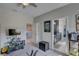 Bedroom featuring a view into the bathroom and a large carpeted area at 11222 Hawks Fern Dr, Riverview, FL 33569