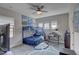 Well-lit room with bunk beds, a ceiling fan, and a study area at 11222 Hawks Fern Dr, Riverview, FL 33569