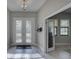 Welcoming foyer featuring tile floors and a modern chandelier at 11222 Hawks Fern Dr, Riverview, FL 33569
