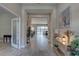 Open hallway with tile floors leads to the living area and pool at 11222 Hawks Fern Dr, Riverview, FL 33569