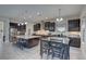 Spacious kitchen with dark wood cabinetry, island, and a connected dining area at 11222 Hawks Fern Dr, Riverview, FL 33569
