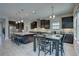Stylish kitchen featuring stainless steel appliances, a kitchen island, and an adjacent dining area at 11222 Hawks Fern Dr, Riverview, FL 33569