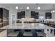 Elegant kitchen boasts stainless steel appliances, granite counters, and custom cabinetry for a modern look at 11222 Hawks Fern Dr, Riverview, FL 33569