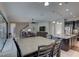 Open floorplan kitchen with granite island, dining area, and a view of the living room at 11222 Hawks Fern Dr, Riverview, FL 33569