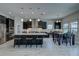 Bright and spacious kitchen with stainless steel appliances, island with seating, and dining area at 11222 Hawks Fern Dr, Riverview, FL 33569