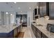 Spacious kitchen features granite counters, stainless appliances, and ample counter space for meal preparation at 11222 Hawks Fern Dr, Riverview, FL 33569
