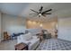 Large living room with a ceiling fan, comfortable seating, and carpet flooring at 11222 Hawks Fern Dr, Riverview, FL 33569