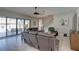 Inviting living room with tile floors, comfortable seating, and easy access to outdoor screened patio at 11222 Hawks Fern Dr, Riverview, FL 33569