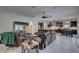 Open-concept living room with tile floors seamlessly connects to the kitchen and dining areas at 11222 Hawks Fern Dr, Riverview, FL 33569