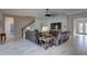 Spacious living room featuring tile floors and comfortable leather furniture, perfect for relaxation at 11222 Hawks Fern Dr, Riverview, FL 33569