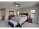 Comfortable main bedroom featuring a large bed, dresser, and multiple windows for ample natural light at 11222 Hawks Fern Dr, Riverview, FL 33569