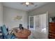 Home office featuring a wood desk, neutral walls, and an adjacent room at 11222 Hawks Fern Dr, Riverview, FL 33569