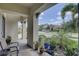 Inviting front porch with paver flooring and lush greenery offering curb appeal at 11222 Hawks Fern Dr, Riverview, FL 33569