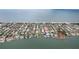 Expansive aerial shot capturing the coastal community with beachfront access and stunning ocean views at 113 16Th St, Belleair Beach, FL 33786