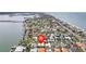 Picturesque aerial view showcasing the community and waterfront homes with easy access to the bay at 113 16Th St, Belleair Beach, FL 33786