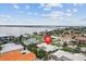 Beautiful aerial perspective showcasing the neighborhood, nearby bay, and stunning waterfront properties at 113 16Th St, Belleair Beach, FL 33786
