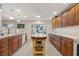 Bright kitchen with island, and generous counter space for food prep. Features recessed lights and pendant lighting at 113 16Th St, Belleair Beach, FL 33786