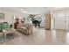 Bright living room features tile floors, lots of natural light, and an open floor plan at 113 16Th St, Belleair Beach, FL 33786