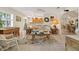 Cozy living room with a ceiling fan, tile floors, and a decorative floral-themed rug at 113 16Th St, Belleair Beach, FL 33786