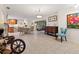 Open-concept living space featuring tile flooring, dining area, and a view into the modern kitchen at 113 16Th St, Belleair Beach, FL 33786