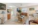 Comfortable living room featuring tile flooring, wicker furniture, and bright, natural light at 113 16Th St, Belleair Beach, FL 33786