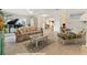 Inviting living room with tile floors, floral sofa, and comfortable seating arrangement creates a relaxed atmosphere at 113 16Th St, Belleair Beach, FL 33786