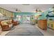 Spacious Gathering room with light-blue walls, ample seating, and direct access to the outdoors offers a relaxed space at 113 16Th St, Belleair Beach, FL 33786