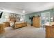 Spacious bedroom with floral accents, plush carpet, and ample natural light provides a comfortable retreat at 113 16Th St, Belleair Beach, FL 33786