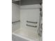 View of the bathtub with safety bars at 11351 Edison Ave, New Port Richey, FL 34654