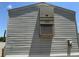Close up of home's exterior with siding and built in AC unit at 11351 Edison Ave, New Port Richey, FL 34654