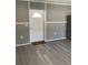 Inviting living room with wood-look flooring and freshly painted walls at 11351 Edison Ave, New Port Richey, FL 34654