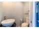 Small half-bath with white vessel sink and toilet at 12456 Spreading Oak Dr, Spring Hill, FL 34609