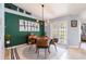 Open dining room with stylish furnishings, decor and backyard access at 12456 Spreading Oak Dr, Spring Hill, FL 34609