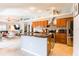Modern kitchen with granite countertops, wooden cabinets and stainless steel appliances at 12456 Spreading Oak Dr, Spring Hill, FL 34609