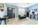 Inviting living room with stylish decor, natural light, and a cozy seating area at 12456 Spreading Oak Dr, Spring Hill, FL 34609