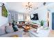 Cozy living room with comfortable seating, large TV, and modern decor at 12456 Spreading Oak Dr, Spring Hill, FL 34609