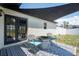 Comfortable outdoor patio with furniture, rug and shade at 12456 Spreading Oak Dr, Spring Hill, FL 34609