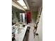 Untidy bathroom featuring a bathtub, toilet and sink at 135 Pinewinds Blvd, Oldsmar, FL 34677