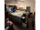 Untidy bedroom with ceiling fan, closet and bed at 135 Pinewinds Blvd, Oldsmar, FL 34677