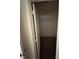 A dark walk-in closet with hanging bar at 135 Pinewinds Blvd, Oldsmar, FL 34677