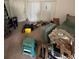 Image shows an untidy living room with furniture and boxes at 135 Pinewinds Blvd, Oldsmar, FL 34677