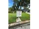 Community mailboxes near a lush green lawn and residences at 135 Pinewinds Blvd, Oldsmar, FL 34677