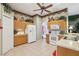 Well-lit kitchen with white appliances and ample cabinet space at 13813 Sigler St, Riverview, FL 33579