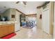 Kitchen with tile flooring, offering views into the dining area and natural light from the window at 13813 Sigler St, Riverview, FL 33579