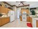 Functional kitchen space with ample cabinet storage, modern appliances, and neutral-toned tile flooring at 13813 Sigler St, Riverview, FL 33579
