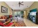 Comfortable living area with access to the patio, showcasing a blend of indoor-outdoor living at 13813 Sigler St, Riverview, FL 33579