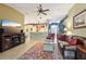 Spacious living room with plush leather seating and ample room for entertaining guests at 13813 Sigler St, Riverview, FL 33579