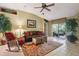 Comfortable living area with a leather couch and access to outdoor patio at 13813 Sigler St, Riverview, FL 33579
