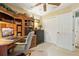 Inviting home office area with built in desk and shelving at 13813 Sigler St, Riverview, FL 33579